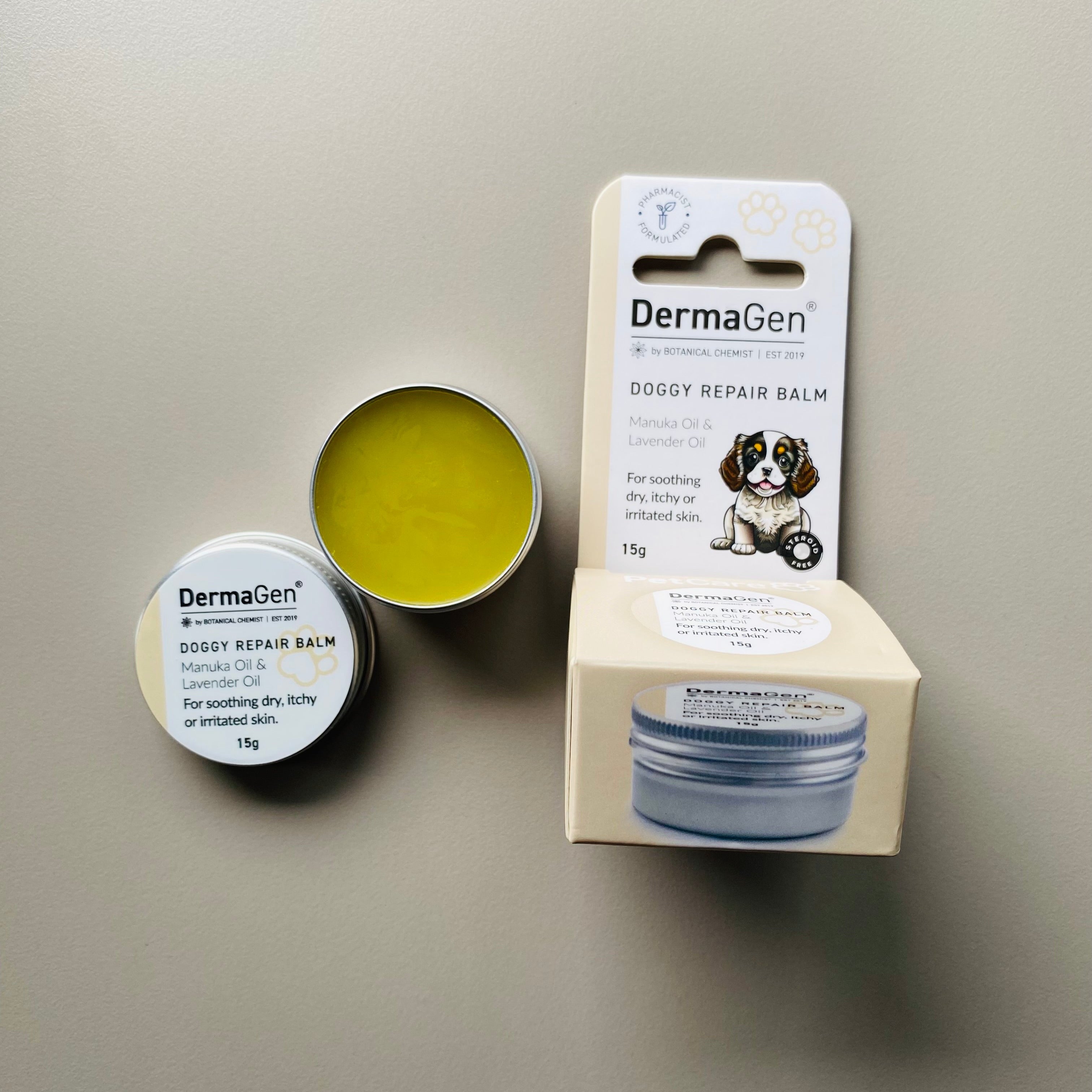 DermaGen Doggy Repair Balm with packaging on a gray background