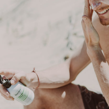 Man applying lotion on a beach