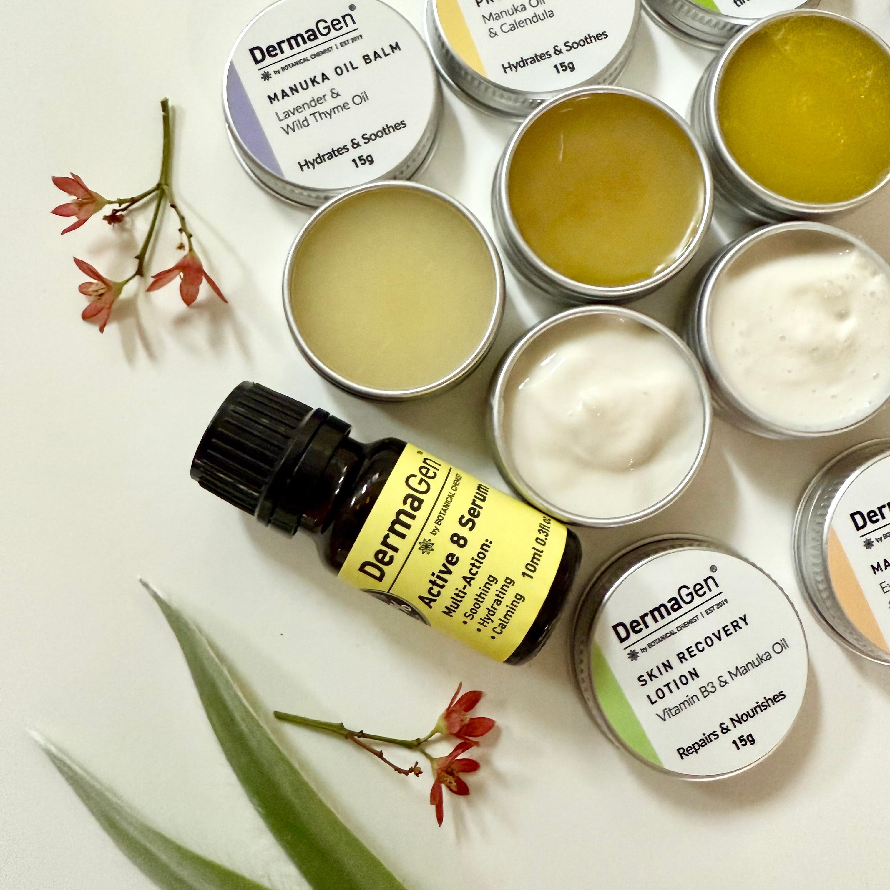 Collection of DermaGen skincare products on a light background with green leaves.